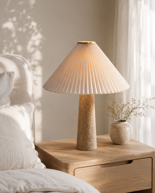 Riviera Travertine Pleated Table Lamp on console table with round mirror